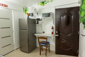 Kitchen with Fridge and Desk