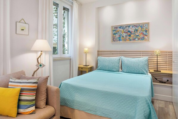 "Indulge in a peaceful night's sleep in our inviting double bed."