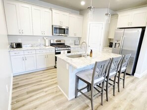 The fully stocked kitchen has everything you will need from pots and pans, bakeware, ample dishware and a full set of children's plastic dishware. 