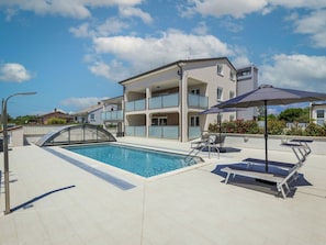 Cloud, Sky, Property, Swimming Pool, Building, Shade, Outdoor Furniture, House, Condominium, Urban Design