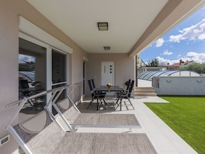 Property, Shade, Chair, Architecture, Interior Design, Sky, Porch, Flooring, Building, Living Room