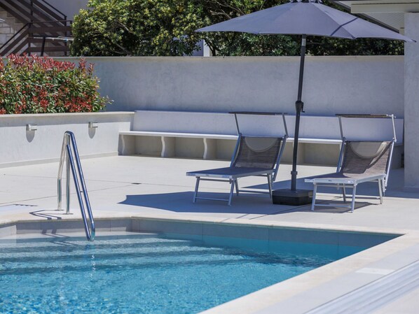 Water, Property, Plant, Swimming Pool, Azure, Sunlounger, Outdoor Furniture, Shade, Architecture, Chair