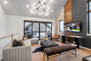 3rd Floor: Bright open living space featuring smart flat-screen TV, designer furnishings, and access to a private balcony with spectacular views of Downtown Nashville. *Hot Tub is Out of Order currently.*
