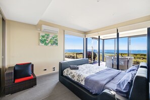 Master bedroom with an ocean view