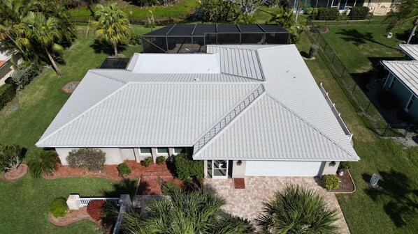 Beautiful curb appeal… Metal tile roof is immaculate and defines the home.