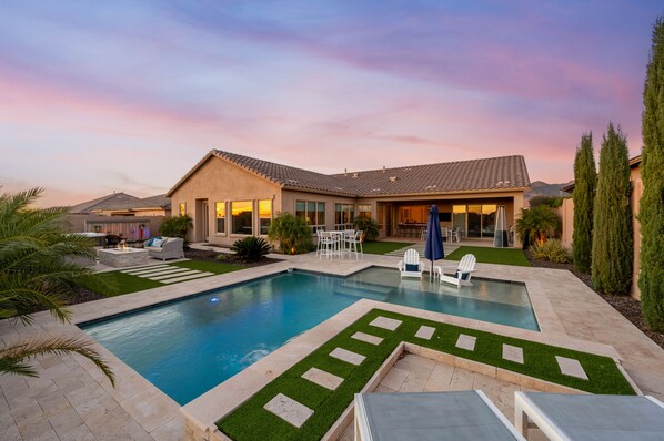 In this beautiful backyard oasis, the sparkling pool takes center stage, inviting you to indulge in refreshing dips or sun tan beneath the Arizona sun.