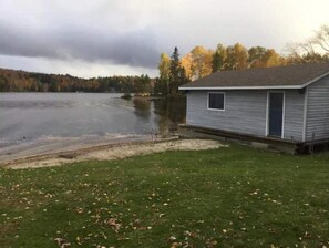 Boathouse with tin boat, Canoe, Paddle board, Peddle boat, some life jackets be 