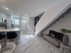 View of under stairs to the right