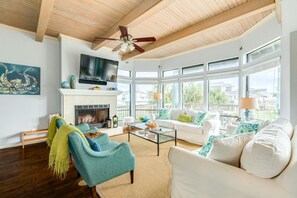 Bright and airy living area with wall of windows