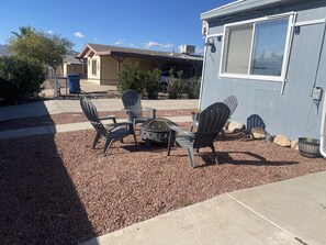 Front outdoor seating area with firepit 