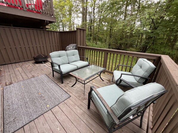 Large back deck perfect for relaxing or entertaining by the fire pit!