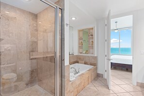 Master Bathroom features walk in shower and oversoaking tub