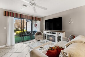 Living room sliding door takes you out to a wonderful patio with outdoor seating.