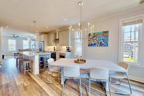 The open concept dining room, kitchen and living room make it easy to spend time together