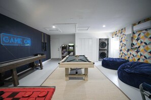 Epic game room with pool table, shuffleboard, arcade games