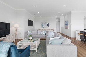 The upstairs living area flows to the balcony, creating a beautiful transition between the indoors and out.
