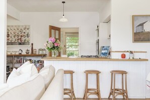 The well-equipped kitchen has all you need to cook up a feast at home, with seating available at the breakfast bar and a dishwasher for easy clean-up.