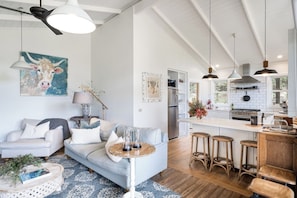 The cottage offers a slow and serene lifestyle in the living room, with cosy lounges, a toasty fireplace and floor-ceiling glass with garden outlooks.