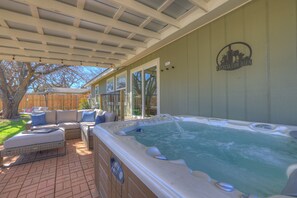 Relaxing soak in the hot tub for six.