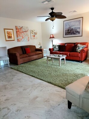 Large Livingroom, has lots of seating, and a queen sleeper sofa!55in. flatscreen