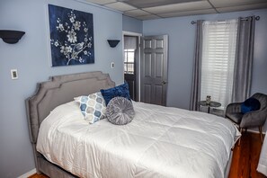 Our bedroom 1 features a queen bed with soft pillows and crisp sheets.