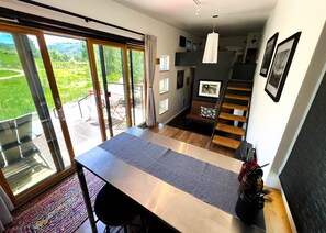 Two seats at kitchen table, plus loveseat sitting area