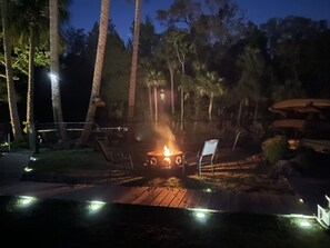 Enjoy the fire pit at night while hearing the fish jump in the river.