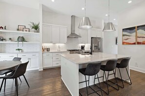 full kitchen  designed with both style and functionality in mind