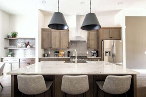 Full kitchen with stainless steel appliances