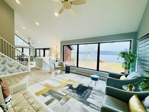 High ceilings and lake views in this gorgeous living room