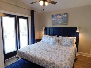 King bedroom upper level with deck access