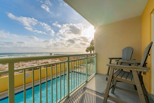 Stunning balcony views with pool and hot tub below and beach access from complex
