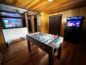 110" projector screen with Roku Stick. Login with your credentials and watch a movie.  

Easy access HDMI connector.  Bring your consoles, melt into the foam lounge chairs and immerse yourself in surround sound gaming on the big screen.

4 Player Arcade Machine with thousands of games to choose from.