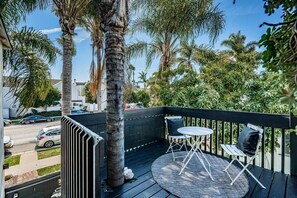 Relax and unwind on our charming deck patio, complete with a cozy bistro set-up. Your perfect spot for savoring morning coffee or enjoying a romantic evening under the stars. Welcome to your private oasis.