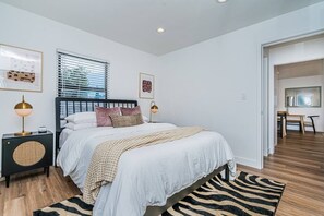 Indulge in comfort! Our secondary queen bedroom offers a cozy retreat with modern elegance. 
