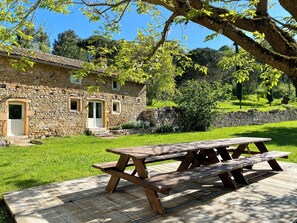 Outdoor dining table in front of the house