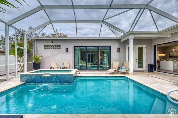 Step into secluded luxury with our private courtyard's opulent pool and spa