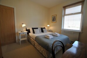 The double bedroom has an outlook over the garden