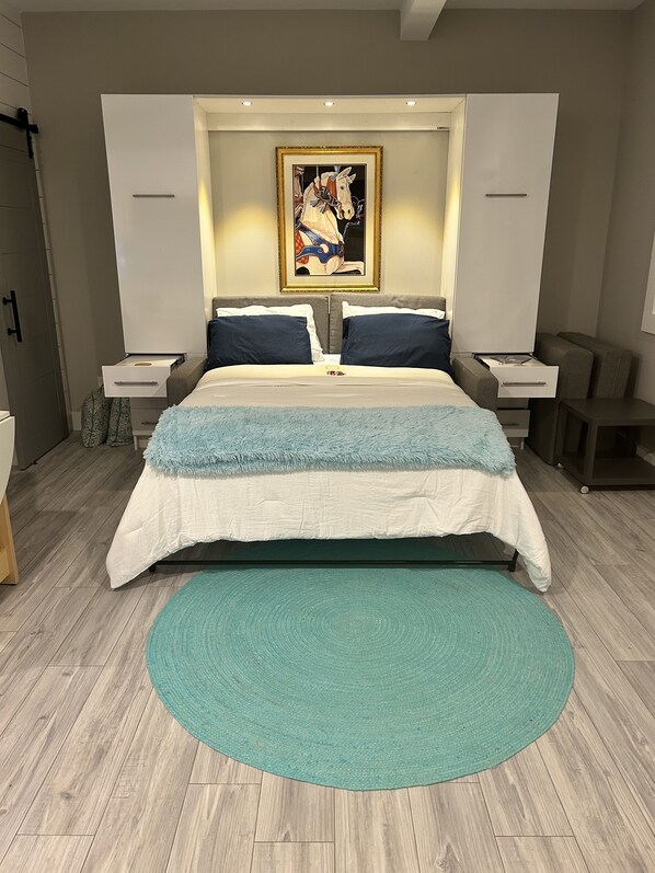 Queen size Murphy Bed doubles as a comfy sofa for lounging.
