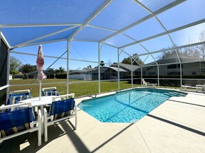 Enjoy poolside dining in a screened patio with beautiful views and plenty of sunshine.