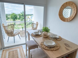 Where Serenity Meets Social: Bask in the Glow of Sunset Conversations and Morning Reflections on Our Balcony and Dining Area.