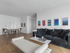 Invites you to unwind amidst soft textures and contemporary Icelandic design.
