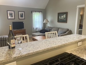 Kitchen through bar to living room