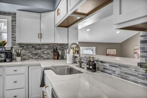 Feel instantly at home in our kitchen, where warmth, functionality, and modern design come together for a delightful cooking experience.