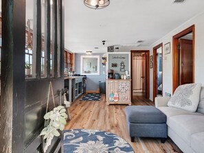 Front door view of living room and kitchen.