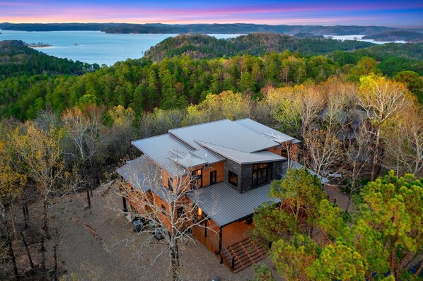 3 story custom built 5000sqft cabin with 180 degree lake views & so much more!