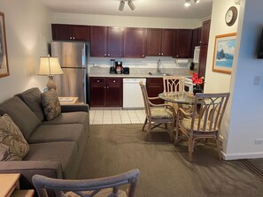 Living room and fully equipped kitchen.