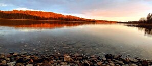 Tranquility on Bass • The sun casting a glow through spring rain clouds •