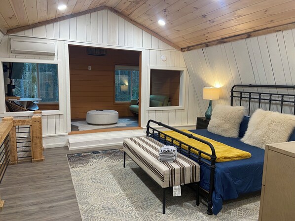 Surrounded by soft linens and soothing ambiance relax on this King bed.