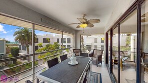 Partial ocean views, ceiling fan, outdoor couch and dining area